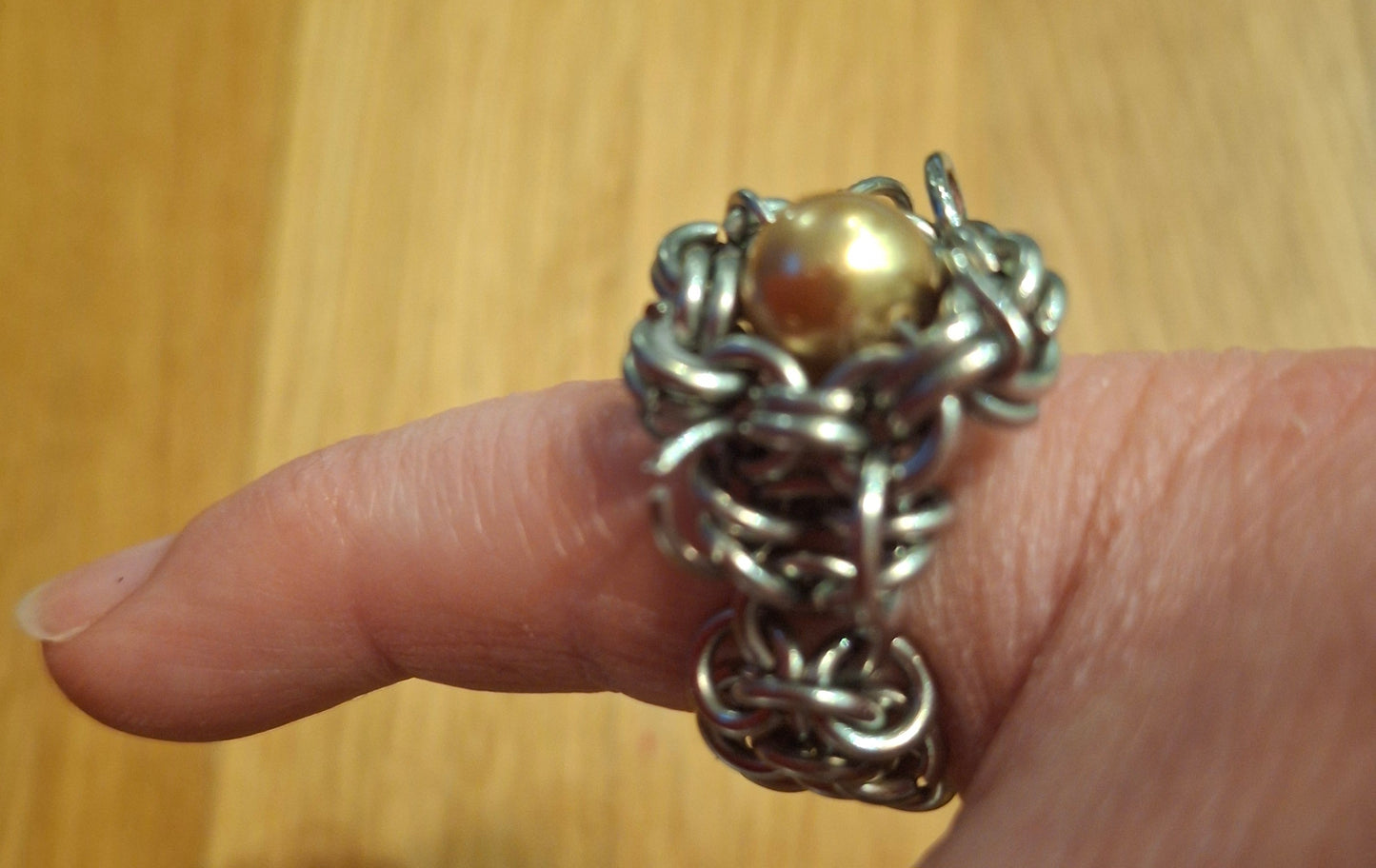 Chainmail stainless steel ring with gold bead