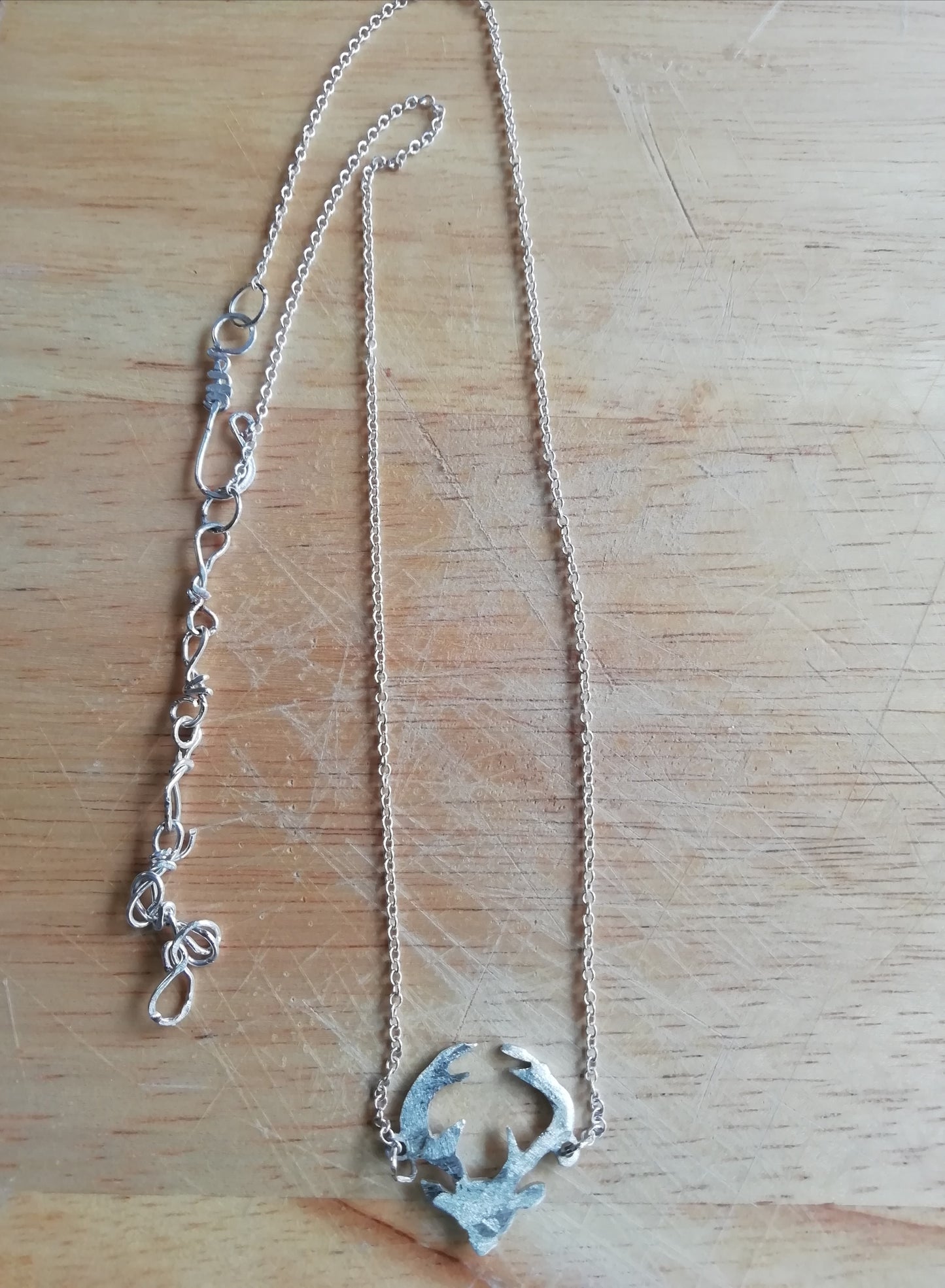 Stag pendant handcut from one shilling coin