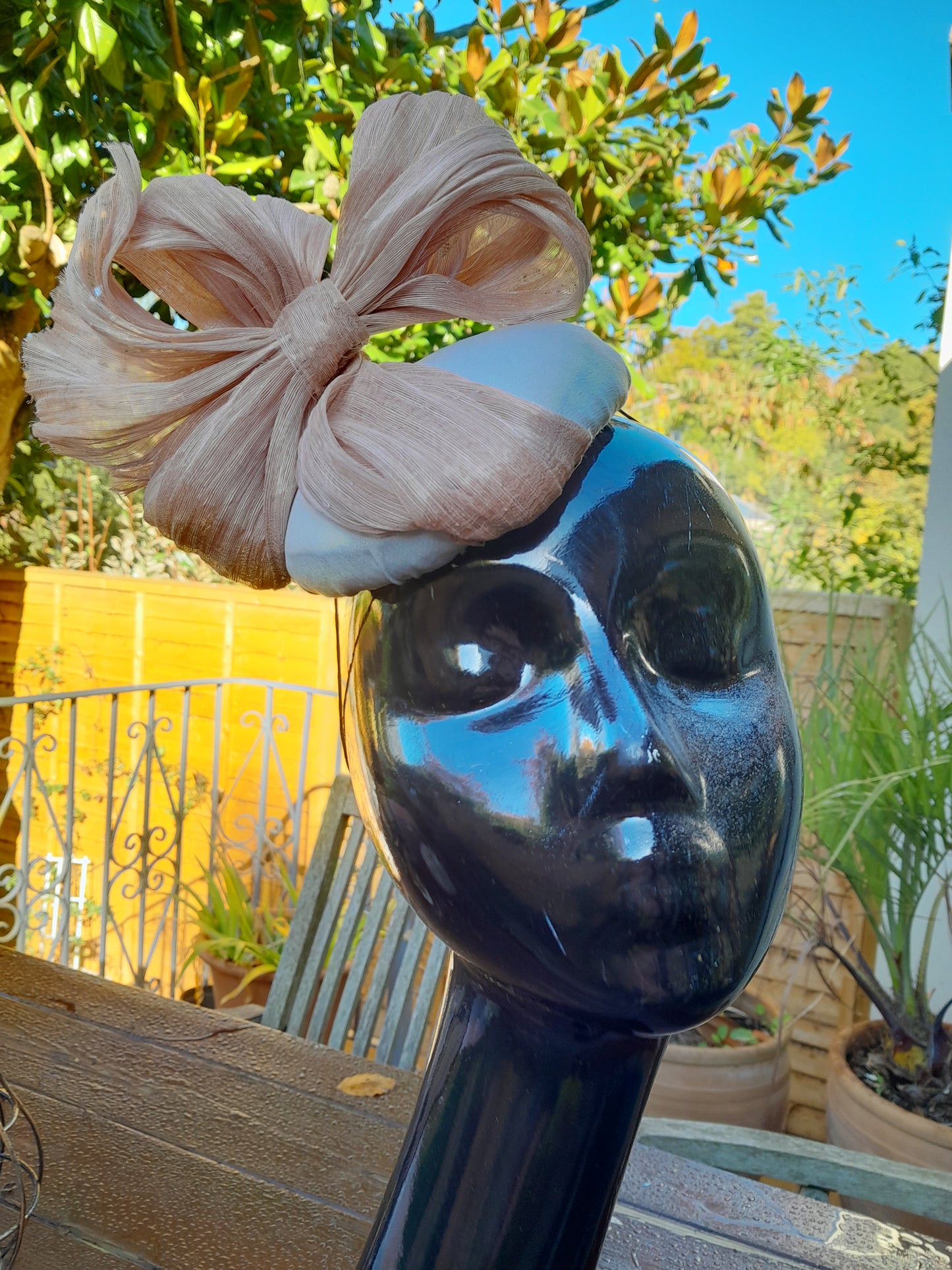 Silver wedding hat with pale pink bow