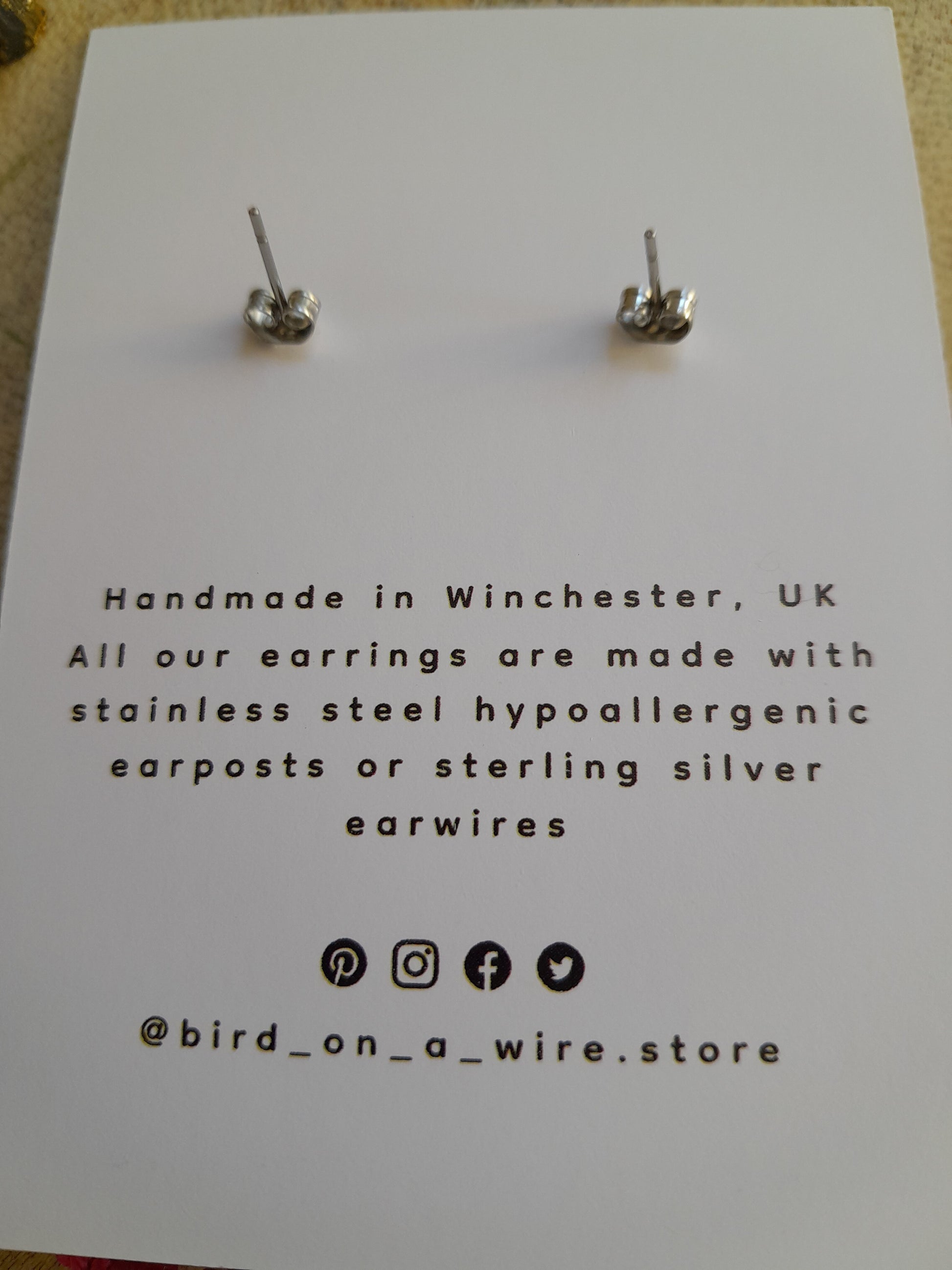 Back of birdonawire.store earring card