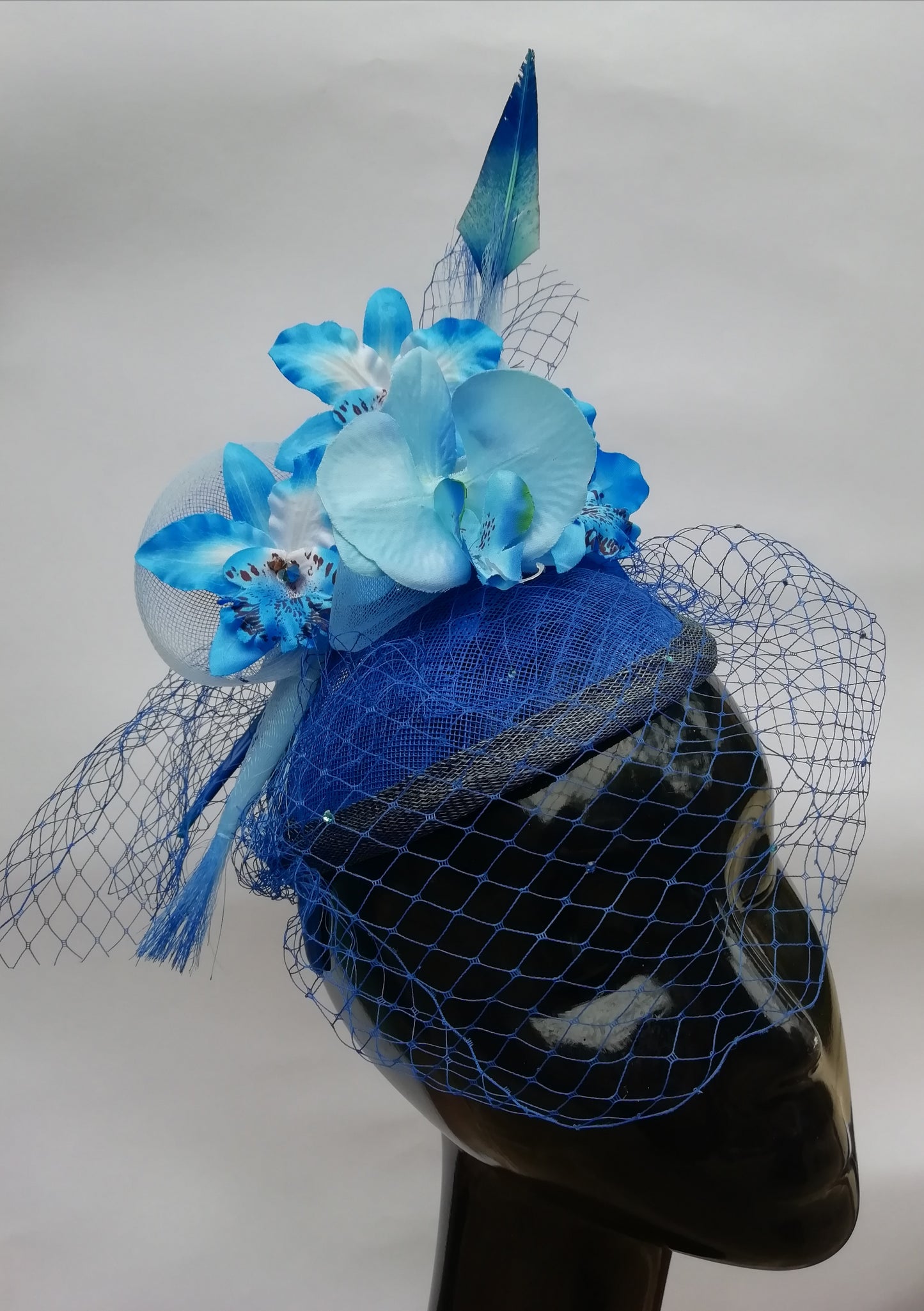 Blue fabric orchids fascinator with blue veiling